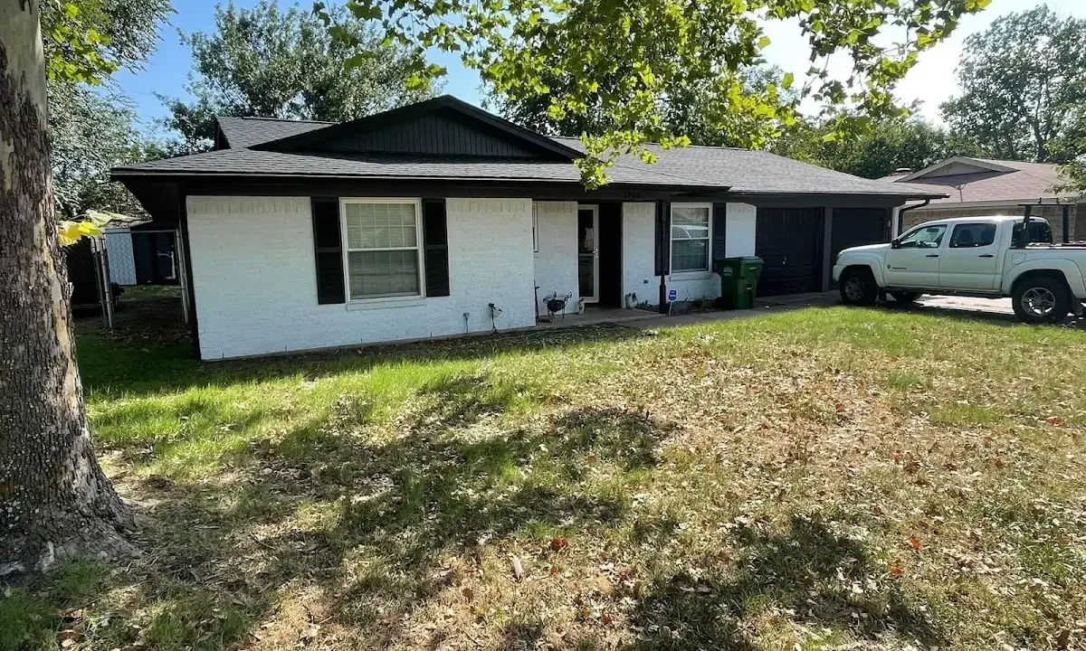 Professional roofing crew working on a residential roof in Mount Rainier